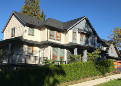 Cream two-storey home with orange-trimmed windows