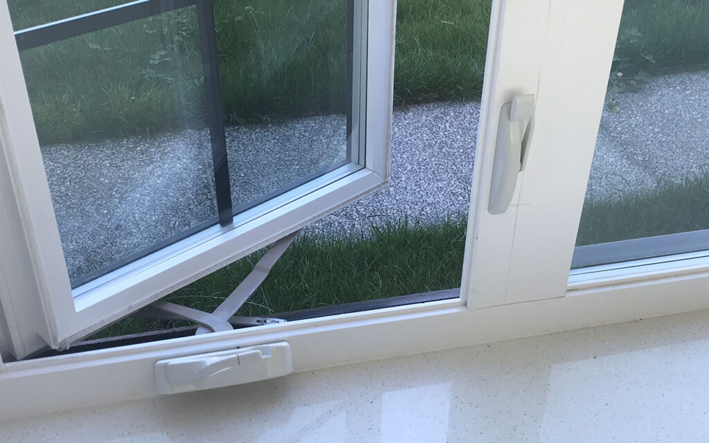 Open casement window showing the sash and handle